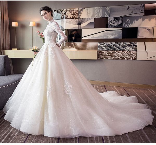 2020 freight high-quality wedding dresses white translucent long-sleeved collar qi large tail lace applique beach dresses hy080
2020 freight high-quality wedding dresses white translucent long-sleeved collar qi large tail lace applique beach dresses hy080