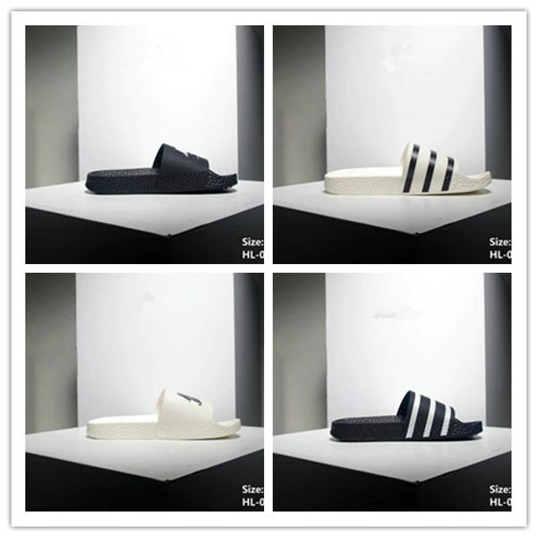 Black Rubber Slide Fashion Sandal Slippers White Stripe Fashion Men Women with Box Classic Ladies Summer Flip Flops
Black Rubber Slide Fashion Sandal Slippers White Stripe Fashion Men Women with Box Classic Ladies Summer Flip Flops