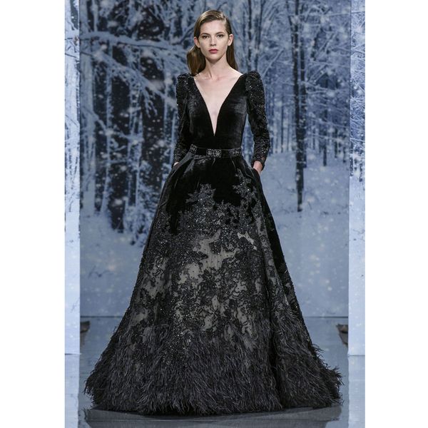 2018 Black Ziad Nakad Feather Evening Dresses Deep V Neck Long Sleeves Sequined Prom Gowns Vestidos De Fiesta Velvet Beaded Formal Dress
2018 Black Ziad Nakad Feather Evening Dresses Deep V Neck Long Sleeves Sequined Prom Gowns Vestidos De Fiesta Velvet Beaded Formal Dress