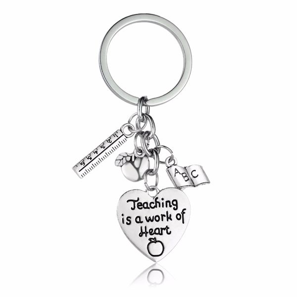 teaching is a work of heart' apple keychain charm abc book pendant heart silver key chains gift for teacher charm jewelry
teaching is a work of heart' apple keychain charm abc book pendant heart silver key chains gift for teacher charm jewelry
