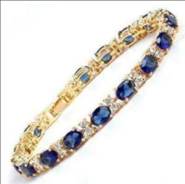 fine blue stone sapphire 18k gold on silver bracelet, Black 
fine blue stone sapphire 18k gold on silver bracelet, Black