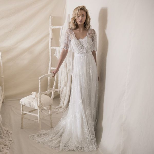 lihi hod lace beach wedding dresses with short sleeves strapless neck bohemian bridal gowns a line boho sweep train vestido de novia, White
lihi hod lace beach wedding dresses with short sleeves strapless neck bohemian bridal gowns a line boho sweep train vestido de novia, White