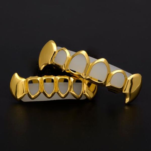 Золотой цвет хип-хоп зубы Grillz полые Верхний Нижний клыки Нижний Grillz набор вампир грили Наборы груза падения
Золотой цвет хип-хоп зубы Grillz полые Верхний Нижний клыки Нижний Grillz набор вампир грили Наборы груза падения