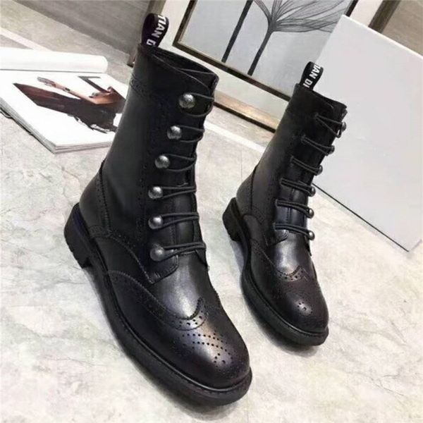 luxury women martin ankle boot in black calf leather with perforated pattern, antique metal buttons and elasticated lacing, 1.5 cm
luxury women martin ankle boot in black calf leather with perforated pattern, antique metal buttons and elasticated lacing, 1.5 cm