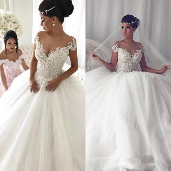 elegant sheer jewel wedding dresses with 3d floral bead appliques short sleeve backless church bridal gown custom made dubai wedding dresses, White
elegant sheer jewel wedding dresses with 3d floral bead appliques short sleeve backless church bridal gown custom made dubai wedding dresses, White