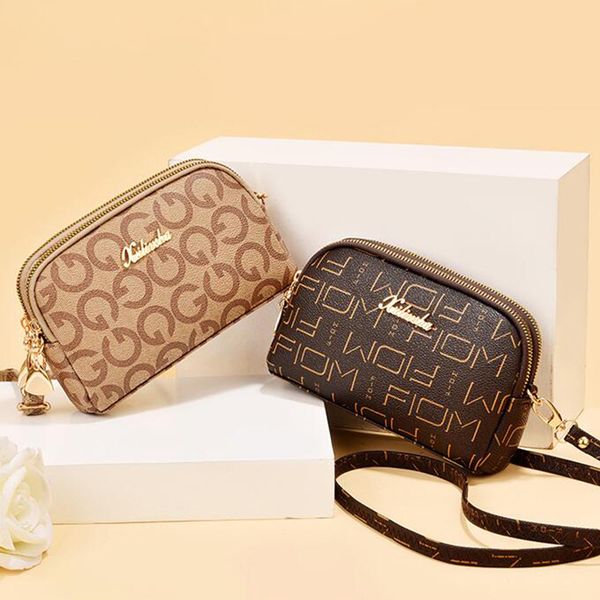 double layer small shoulder messenger bag ladies purse european and american shell mobile phone bag with wrist strap a30
double layer small shoulder messenger bag ladies purse european and american shell mobile phone bag with wrist strap a30