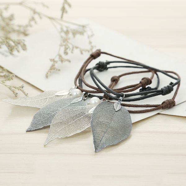 new style braids the leather rope bracelet bracelet leaf pendant fashionable joker men and women may take the jewelry gift, Black
new style braids the leather rope bracelet bracelet leaf pendant fashionable joker men and women may take the jewelry gift, Black