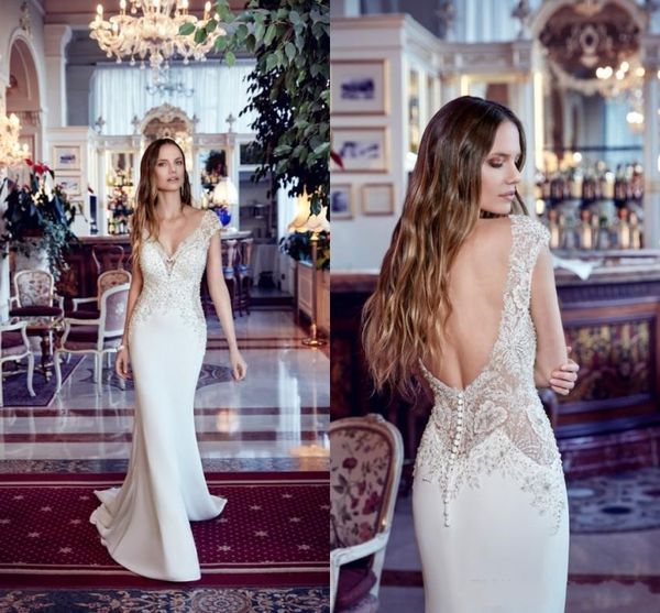 Designed Mermaid Wedding Dresses 2019 Sheer Cap Sleeve V Cut Backless With Buttons Plunging Neckline Applique Bridal Gowns With Court Train
Designed Mermaid Wedding Dresses 2019 Sheer Cap Sleeve V Cut Backless With Buttons Plunging Neckline Applique Bridal Gowns With Court Train