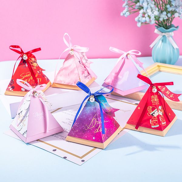 new triangle pyramid candy favor boxes wedding favors and gifts packing bags baby shower paper gift boxes for party supplies 
new triangle pyramid candy favor boxes wedding favors and gifts packing bags baby shower paper gift boxes for party supplies