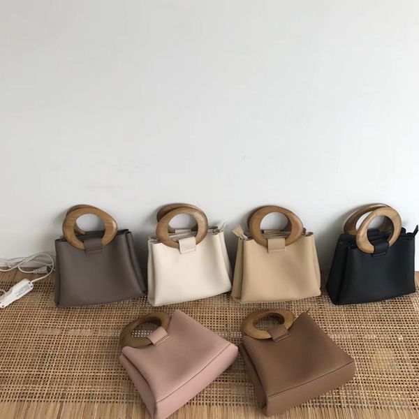 stylish wooden handle women's tote simple pu leather women hand bags luxury handbags women bags designer purses
stylish wooden handle women's tote simple pu leather women hand bags luxury handbags women bags designer purses