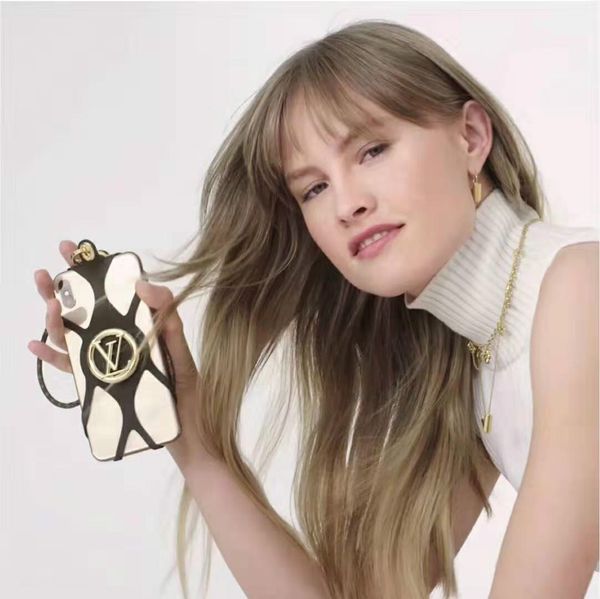 designer phone holder luxury phone case lanyard silicone holder gold-color hardware embossed gold-color metal brand logo motif with box 
designer phone holder luxury phone case lanyard silicone holder gold-color hardware embossed gold-color metal brand logo motif with box