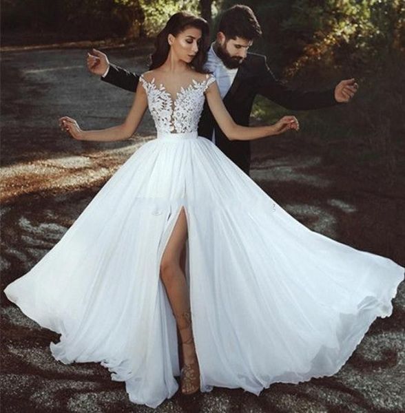 2018 gorgeous beach wedding dresses sheer neck cap sleeves appliques lace chiffon side split illusion back boho wedding gowns bridal dresses, White
2018 gorgeous beach wedding dresses sheer neck cap sleeves appliques lace chiffon side split illusion back boho wedding gowns bridal dresses, White