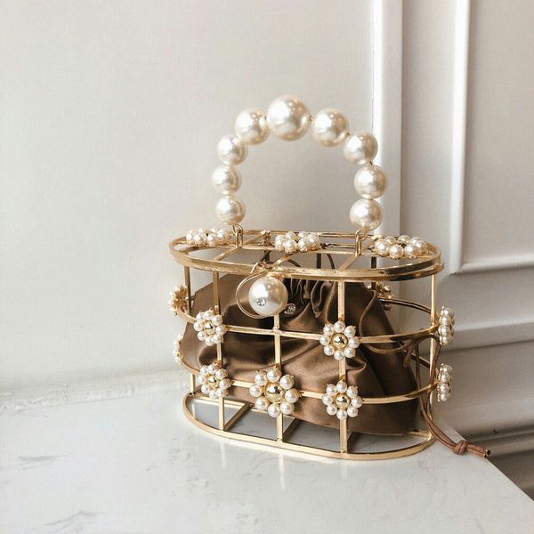 лето новый вид корейского сплава выдолбленные цветы pearls матери сумки instrendy растительные корзины сумки
лето новый вид корейского сплава выдолбленные цветы pearls матери сумки instrendy растительные корзины сумки