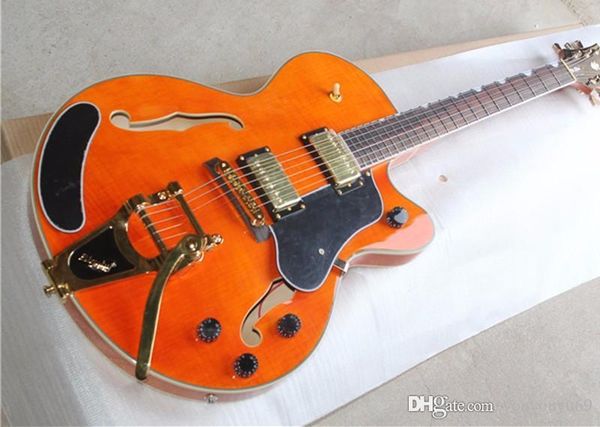 manufacturer custom orange hollow body electric guitar vibrato bridge system body connection custom color label
manufacturer custom orange hollow body electric guitar vibrato bridge system body connection custom color label