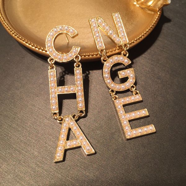 new trendy popular fashion luxury designer exaggerated pearl number letter cha stud earrings for women gold color, Golden;silver
new trendy popular fashion luxury designer exaggerated pearl number letter cha stud earrings for women gold color, Golden;silver