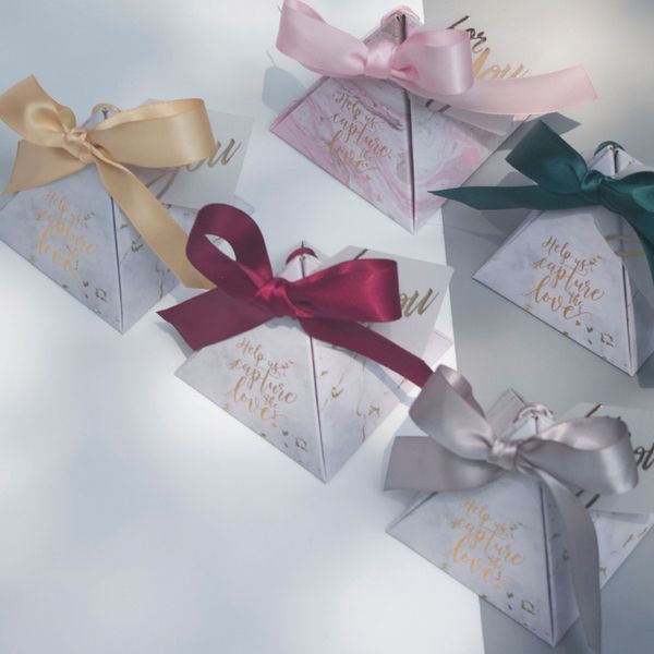 gift wrap triangular pyramid wedding favors and box paper candy boxes with ribbons card for baby shower guests decoration
gift wrap triangular pyramid wedding favors and box paper candy boxes with ribbons card for baby shower guests decoration