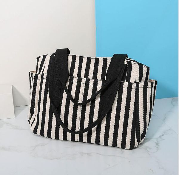 new striped canvas bag female shoulder wild casual canvas bag large capacity shopping tote
new striped canvas bag female shoulder wild casual canvas bag large capacity shopping tote