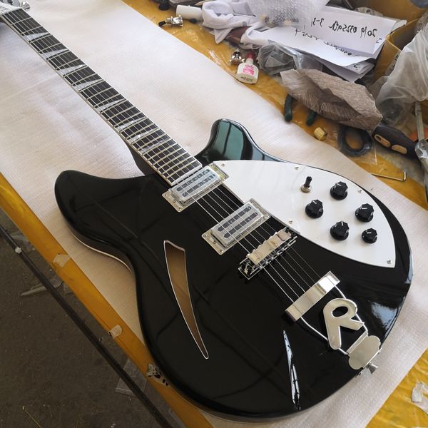 360 6 string hollow body black electric guitar single hole, white mop triangle fingerboard inlay
360 6 string hollow body black electric guitar single hole, white mop triangle fingerboard inlay
