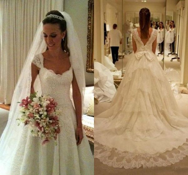 Newest A Line Wedding Dresses Lace Cap Sleeve Tier Ruffle Sweep Train With Big Bow Belt Long Backless Bridal Gowns
Newest A Line Wedding Dresses Lace Cap Sleeve Tier Ruffle Sweep Train With Big Bow Belt Long Backless Bridal Gowns
