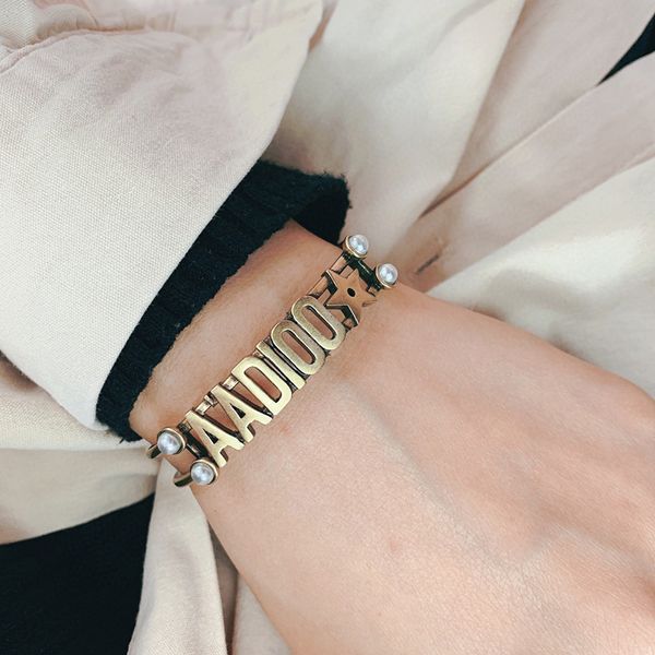 c1933 european and american style new classic letter bracelet retro imitation pearl opening adjustable bracelet simple high-end jewelry, Black
c1933 european and american style new classic letter bracelet retro imitation pearl opening adjustable bracelet simple high-end jewelry, Black