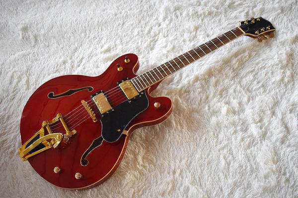 factory custom semi-hollow wine red electric guitar with tremolo system,gold hardware,cream binding,can be customized
factory custom semi-hollow wine red electric guitar with tremolo system,gold hardware,cream binding,can be customized