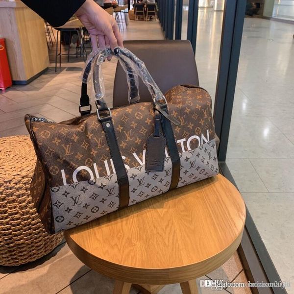 fashion designer genuine leather men duffle bag women travel bags luggage luxury designer travel bag men leather handbags large totes 55cm
fashion designer genuine leather men duffle bag women travel bags luggage luxury designer travel bag men leather handbags large totes 55cm