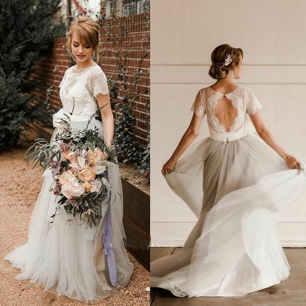 2019 Charming Bohemian Wedding Dresses Jewel Appliques Lace Short Sleeve A Line Long Beach Country Bridal Gowns Vestido de noiva
2019 Charming Bohemian Wedding Dresses Jewel Appliques Lace Short Sleeve A Line Long Beach Country Bridal Gowns Vestido de noiva