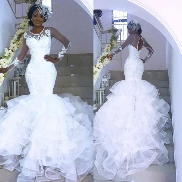 2020 sheer see through african mermaid lace white wedding dresses long sleeves open back tiered skirts nigerian bridal wedding gowns 
2020 sheer see through african mermaid lace white wedding dresses long sleeves open back tiered skirts nigerian bridal wedding gowns