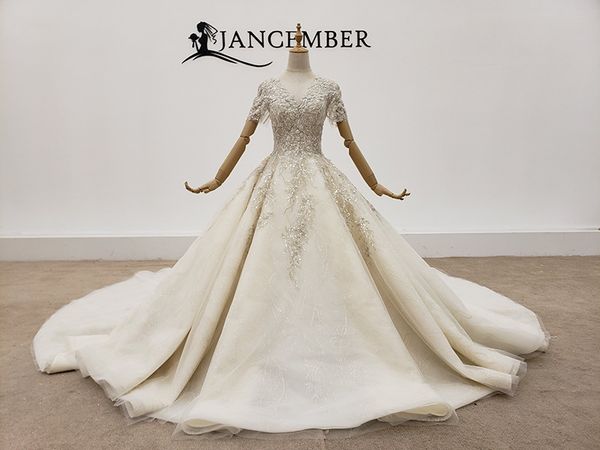 hand made wedding dress with deep v-neck, bright crystal, luxury and shiny sequins, lace and white tailed light dress
hand made wedding dress with deep v-neck, bright crystal, luxury and shiny sequins, lace and white tailed light dress