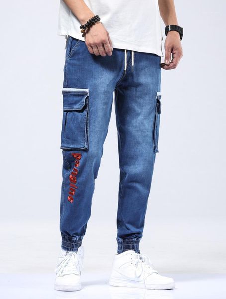 size mens designer jeans fashion multi pocket harem pants loose letter print casual trousers male clothing plus, Blue 
size mens designer jeans fashion multi pocket harem pants loose letter print casual trousers male clothing plus, Blue