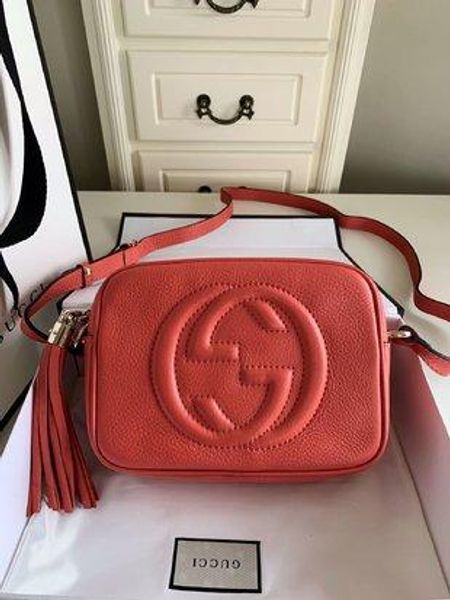 compact shoulder bag with a leather tassel zipper pull. luxury style leather handbag handbag soho small leather disco bag