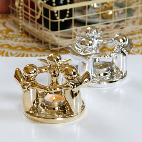 plating gold and silver three angel ceramic candlestick candle holder candle cup wind lamp european home decoration
plating gold and silver three angel ceramic candlestick candle holder candle cup wind lamp european home decoration