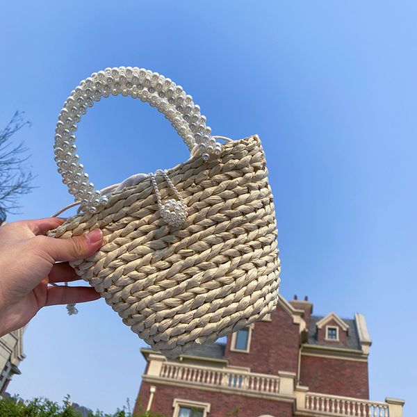 summer hand-woven bags female 2020 new tide messenger beach bag ins lapbucket pearl straw bags 
summer hand-woven bags female 2020 new tide messenger beach bag ins lapbucket pearl straw bags