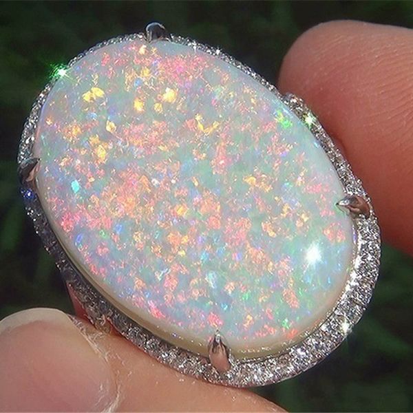 shiny oversized oval egg fire opal ladies ring 4 claw inlaid peripheral fine crystal wedding ring
shiny oversized oval egg fire opal ladies ring 4 claw inlaid peripheral fine crystal wedding ring