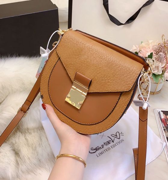 est brand women's high-end tote bag designer letters studs large shopping bag fashion one shoulder saddle postage poor and motorcycle b 
est brand women's high-end tote bag designer letters studs large shopping bag fashion one shoulder saddle postage poor and motorcycle b