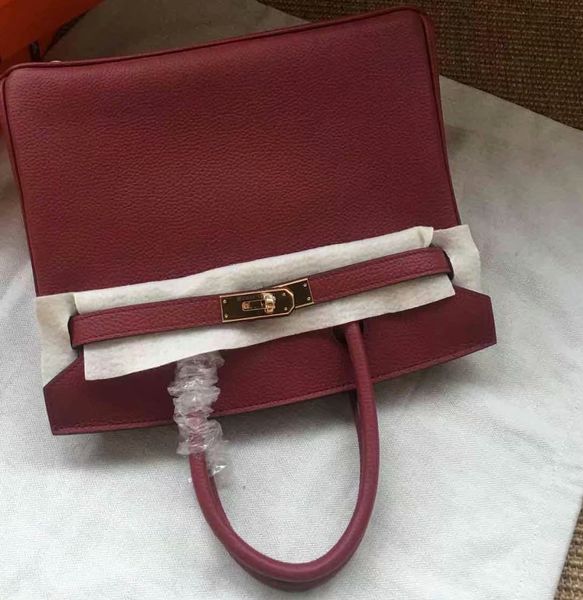 original design burgundy togo purse calf skin made by machine,gold,silver hardware,size25 30 35cm for chosen,fast delivery 
original design burgundy togo purse calf skin made by machine,gold,silver hardware,size25 30 35cm for chosen,fast delivery