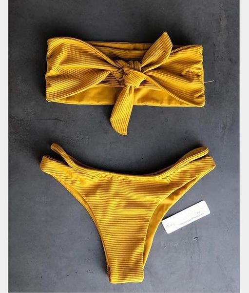 bikini lady's split bathing suit with pits and knots in front of her chest
bikini lady's split bathing suit with pits and knots in front of her chest
