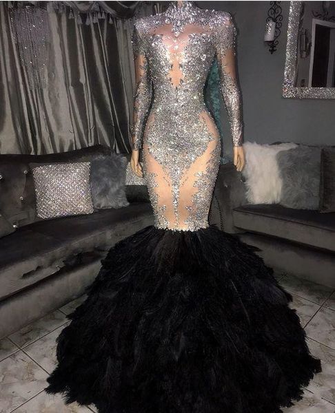2020 sheer neck sparkly silver lace appliques mermaid prom dresses long sleeves with black feather plus size formal evening occasion gowns
2020 sheer neck sparkly silver lace appliques mermaid prom dresses long sleeves with black feather plus size formal evening occasion gowns