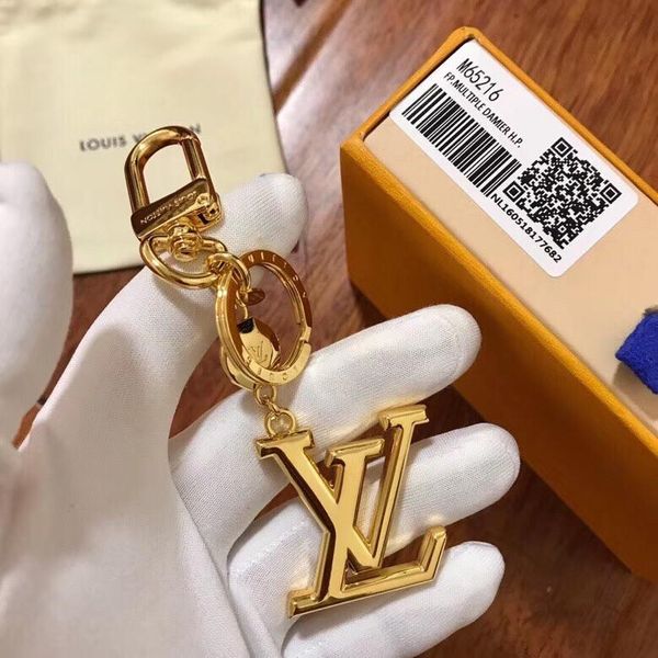 Дизайнерские модные аксессуары MONOGRAM DELIGHT Сумка и брелок из 18-каратного желтого зо
Дизайнерские модные аксессуары MONOGRAM DELIGHT Сумка и брелок из 18-каратного желтого зо