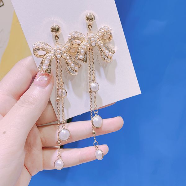 new hang pearl dangling bow tassel long earrings studded with crystal fashion jewelry accessories for women christmas gift, Silver
new hang pearl dangling bow tassel long earrings studded with crystal fashion jewelry accessories for women christmas gift, Silver