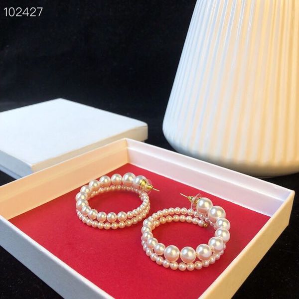 wholesale-preclous copper gold plated white pearl hollow round circle charm loop earrings for women jewelry, Golden
wholesale-preclous copper gold plated white pearl hollow round circle charm loop earrings for women jewelry, Golden