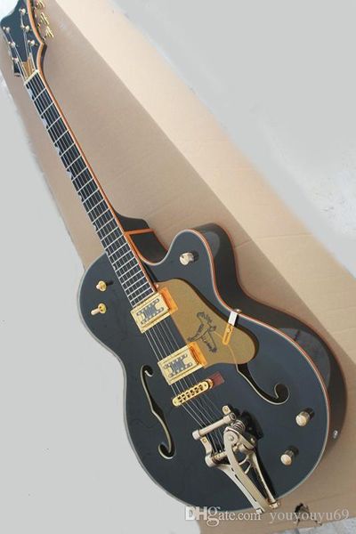black electric guitar with gold guard, ebony fingerboard, vibrato system, gold hardware, precision production, customized serv
black electric guitar with gold guard, ebony fingerboard, vibrato system, gold hardware, precision production, customized serv