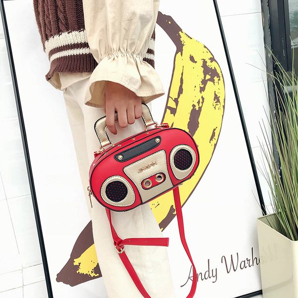 personality retro radio handbags new fashion women's portable rock fan shoulder bag diagonal across the tide back pack 
personality retro radio handbags new fashion women's portable rock fan shoulder bag diagonal across the tide back pack