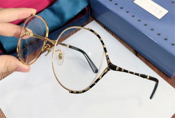 new fashion designer optical glasses 0596 large frame hollow metal frame popular style hd clear lens
new fashion designer optical glasses 0596 large frame hollow metal frame popular style hd clear lens