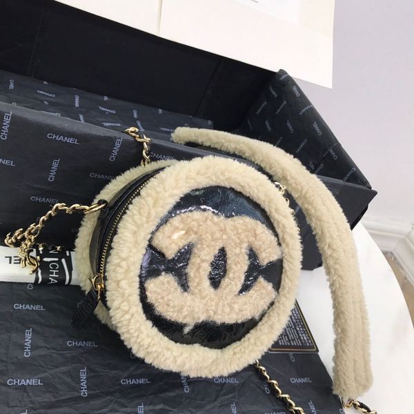 classic women's small round bag leather very individual burst skin and lamb wool in one touch texture with a long shoulder strap
classic women's small round bag leather very individual burst skin and lamb wool in one touch texture with a long shoulder strap