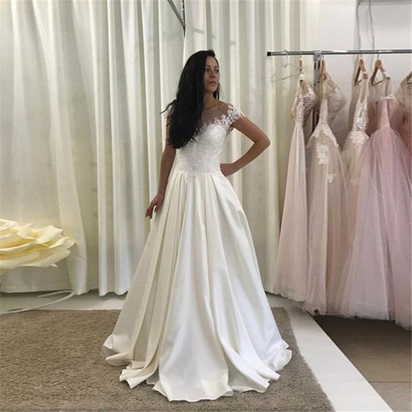 stunning jewel neck short sleeve lace wedding dresses appliques plus size a line custom made formal bridal gown arabic, White
stunning jewel neck short sleeve lace wedding dresses appliques plus size a line custom made formal bridal gown arabic, White