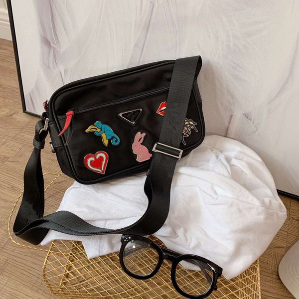 2020 badges oblique nylon male and female bag single girls boys shoulder both men and women purses handbags package
2020 badges oblique nylon male and female bag single girls boys shoulder both men and women purses handbags package