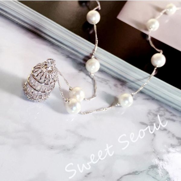 designer jewelry sweater pearl necklace birdcage hollow out zircon pendant necklace for women classic fashion, Silver
designer jewelry sweater pearl necklace birdcage hollow out zircon pendant necklace for women classic fashion, Silver