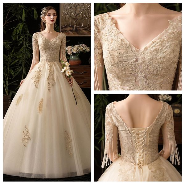 unique design champagne v-neck wedding dress bohemian floor length lace applique wedding dress a lline with tassel half sleeve wedding gown, White
unique design champagne v-neck wedding dress bohemian floor length lace applique wedding dress a lline with tassel half sleeve wedding gown, White