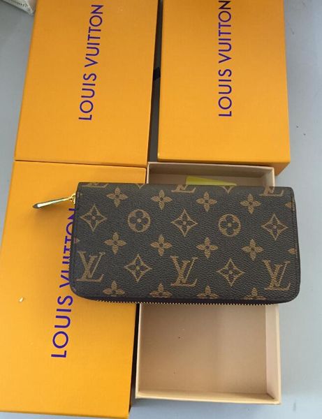 Brand new men and women holding a pur e ingle zipper banknote folder card wallet orange box card 4 color elling
Brand new men and women holding a pur e ingle zipper banknote folder card wallet orange box card 4 color elling